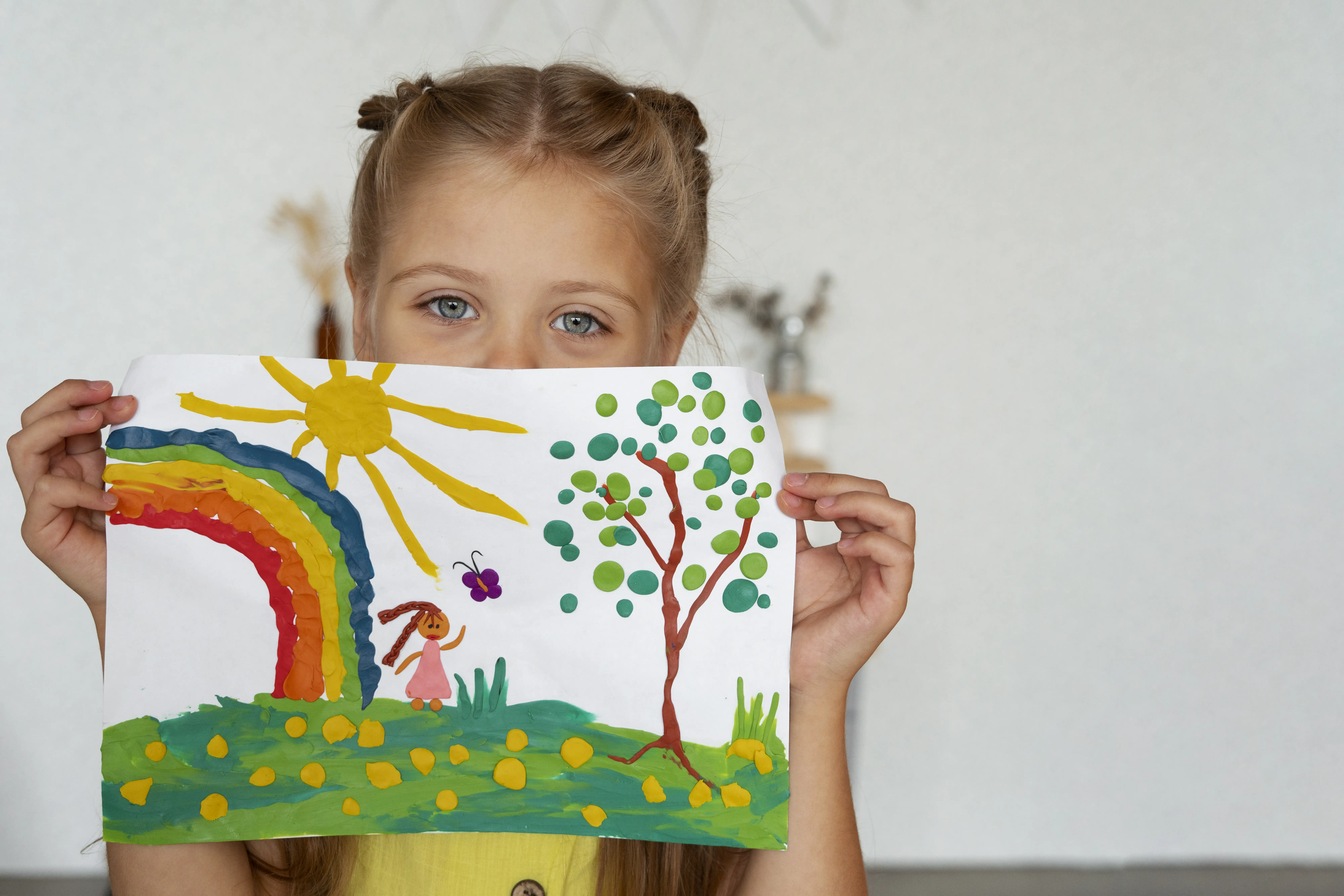 girl with rainbow drawing